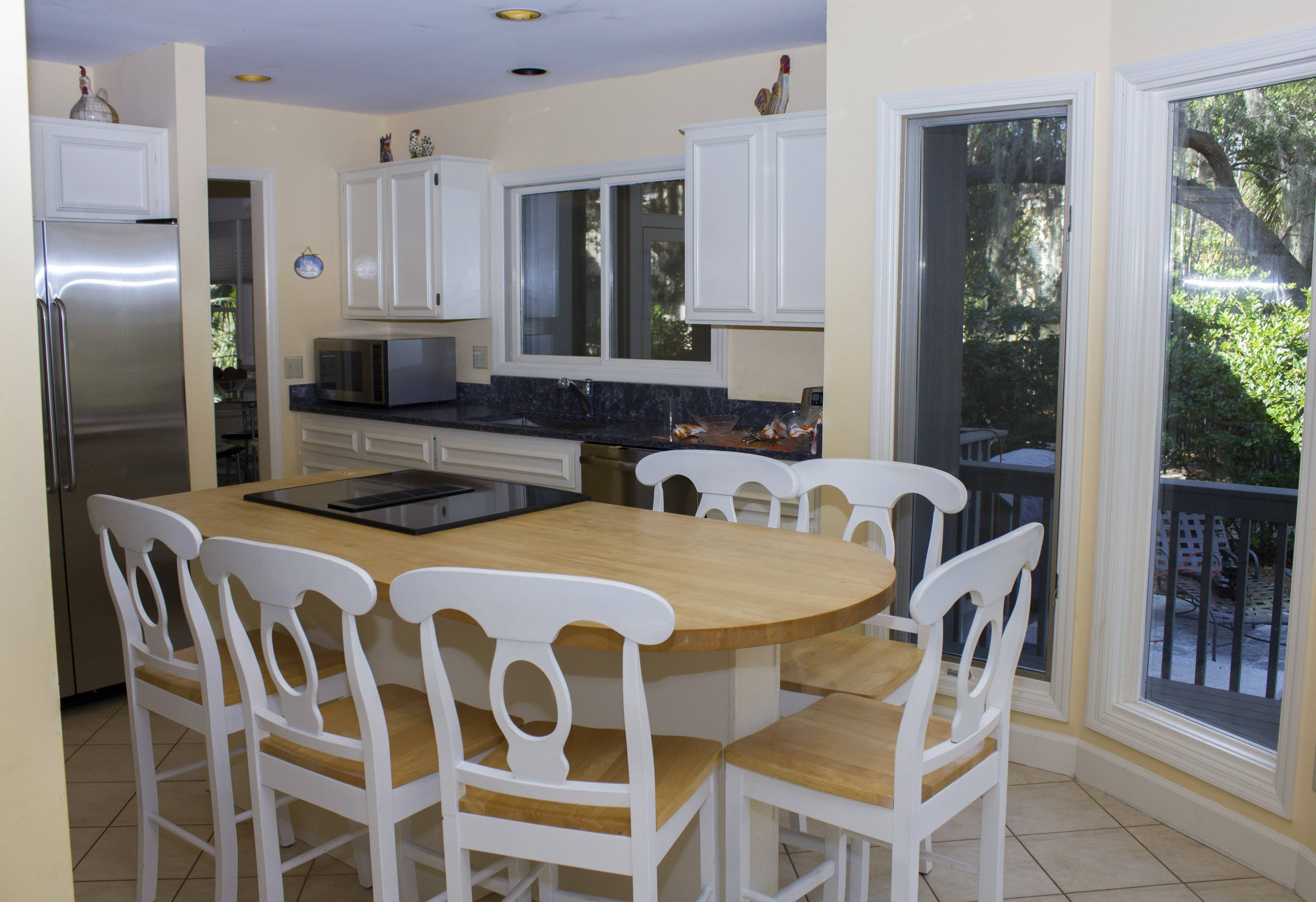 Butcher block island with seating for Kitchen gatherings