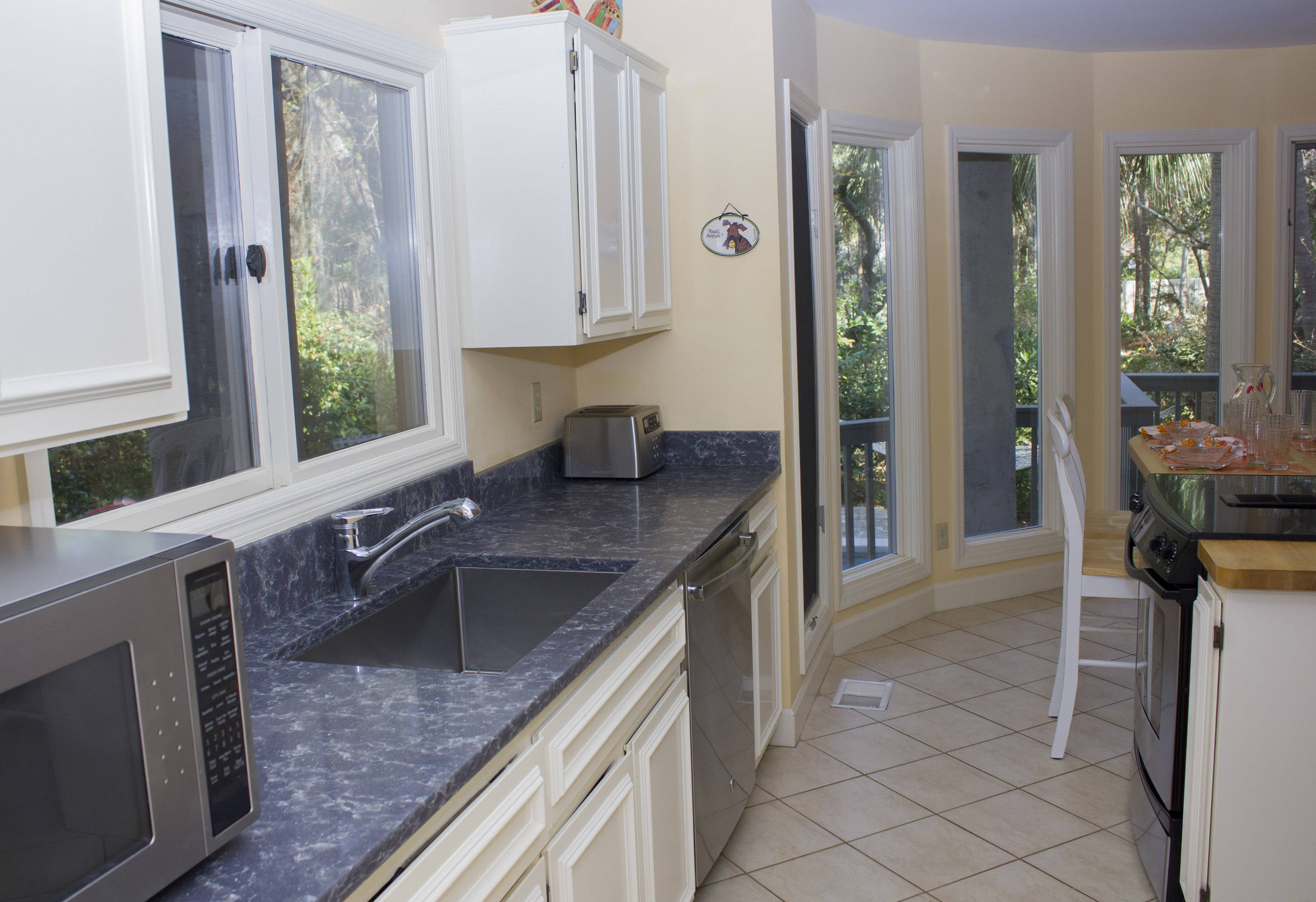 Quartz counters with deep sink and European designed faucet.